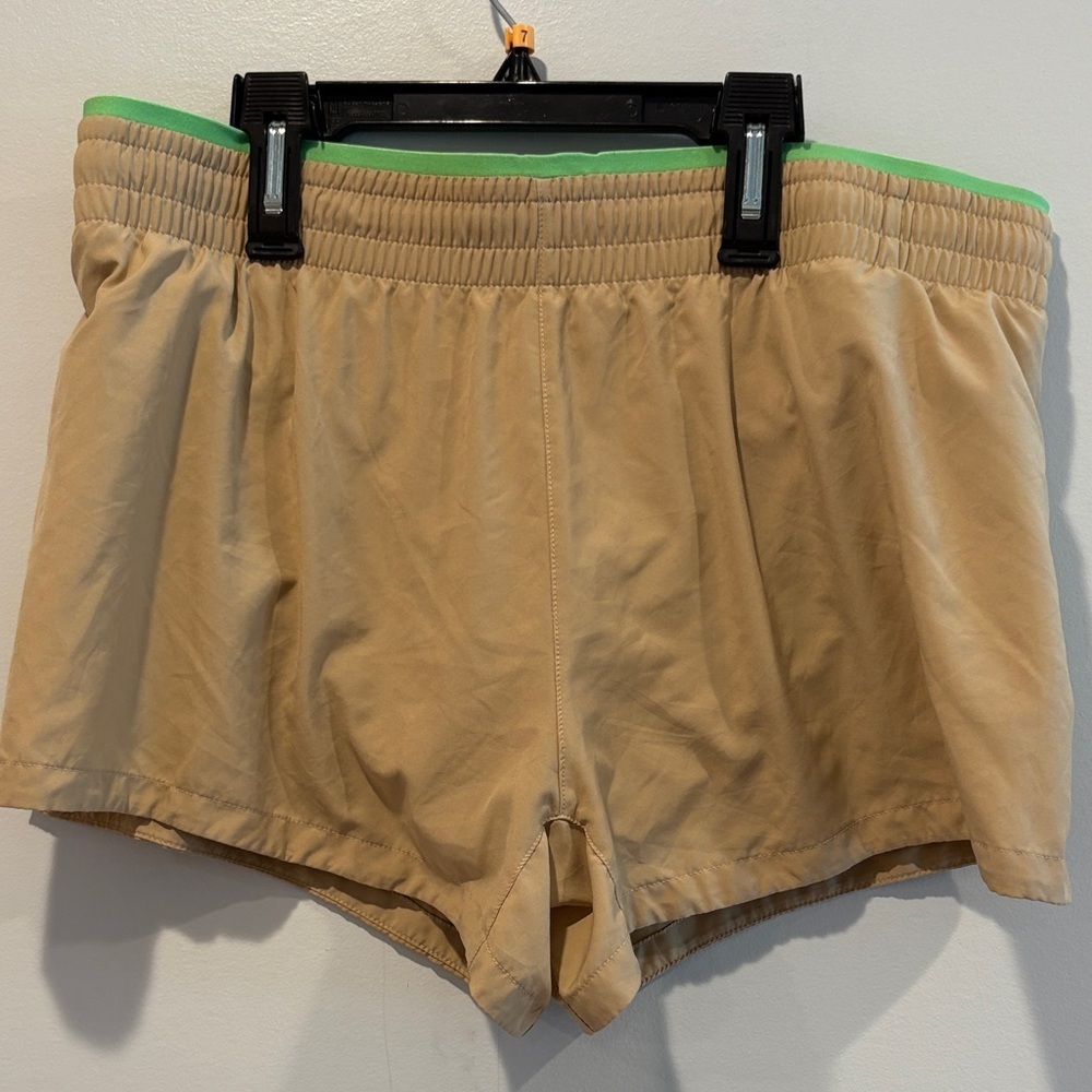 Fabletics Tan Athletic Shorts with Green Waistband